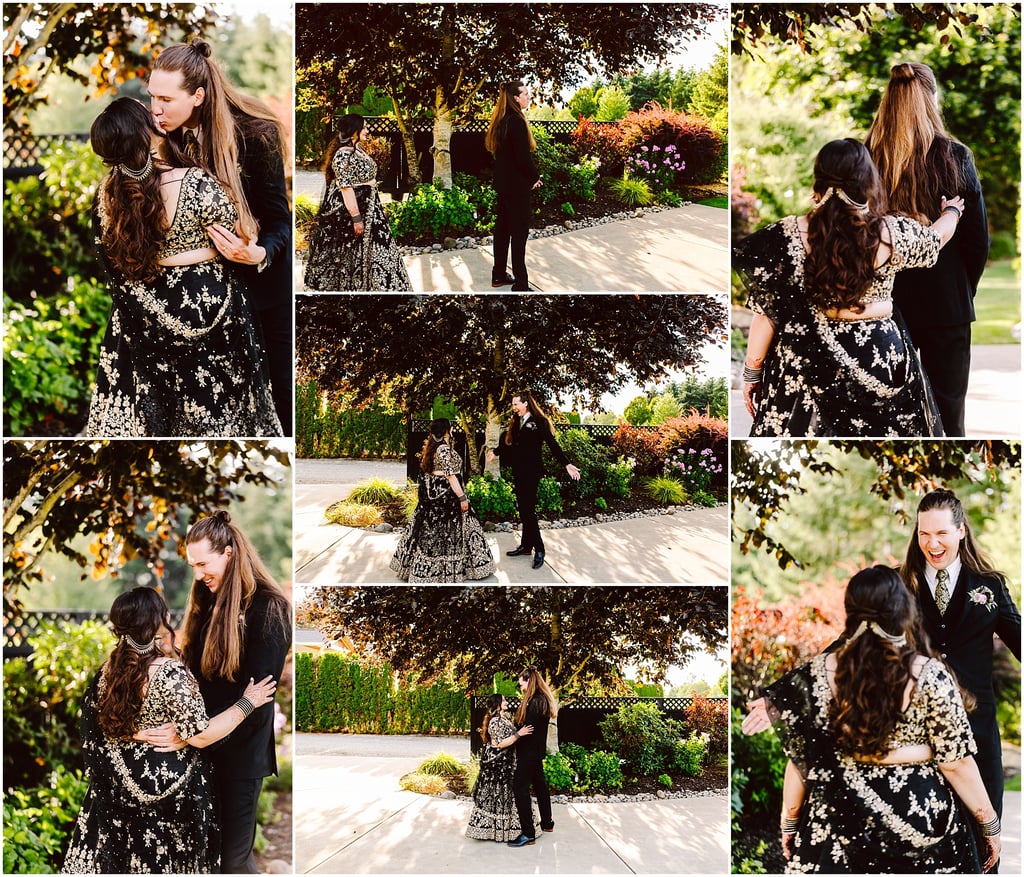 Couple embracing in a sunlit garden; woman in a black and gold embroidered lehenga, man in a black suit.