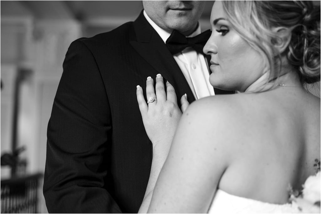 Premier Snohomish & Seattle Wedding Photographer | GSquared Weddings Photography A bride, showing her engagement ring, gently rests her hand on the chest of a groom in a tuxedo. Their faces are partially visible in this timeless black and white Snohomish Seattle wedding engagement photo. 47.9129° N, 122.0982° W | Serving Snohomish, Seattle , Orlando & Beyond