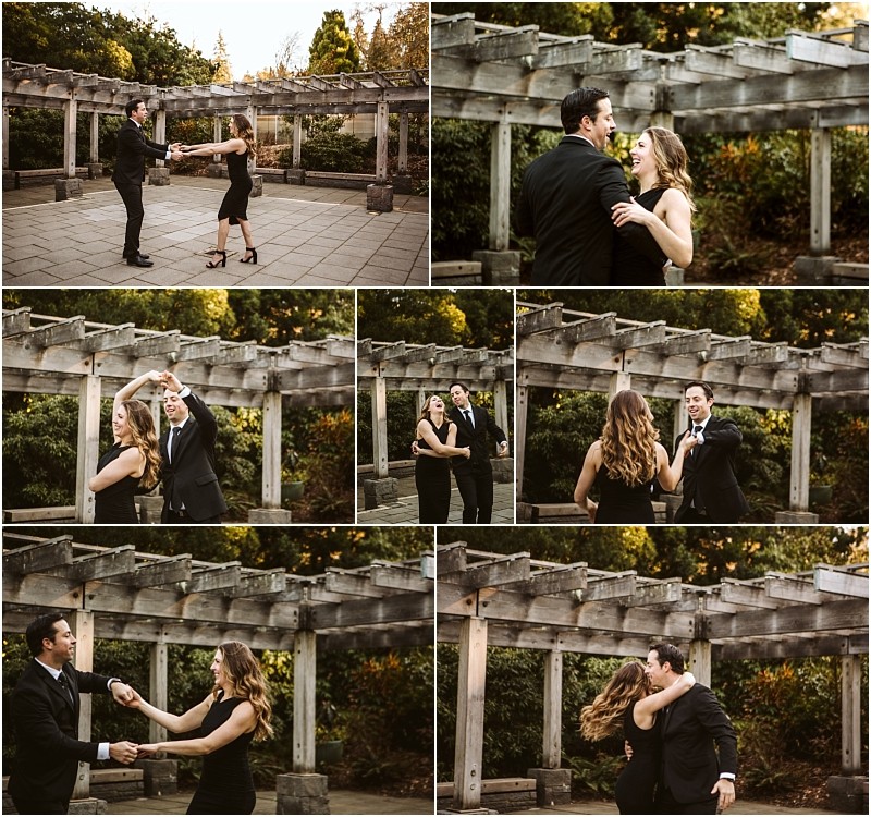 Premier Snohomish & Seattle Wedding Photographer | GSquared Weddings Photography A couple in formal black attire dances together outdoors beneath a wooden pergola, smiling and twirling each other, surrounded by greenery and warm sunlight at a romantic Snohomish Seattle wedding engagement. 47.9129° N, 122.0982° W | Serving Snohomish, Seattle , Orlando & Beyond