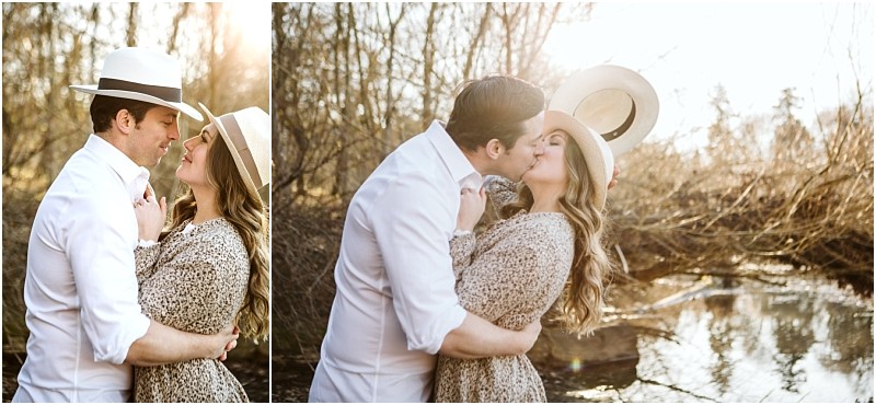 Premier Snohomish & Seattle Wedding Photographer | GSquared Weddings Photography A couple embraces and kisses outdoors by a creek near Snohomish, both wearing hats and casual clothes, with warm sunlight filtering through trees—a perfect Seattle wedding engagement moment. 47.9129° N, 122.0982° W | Serving Snohomish, Seattle , Orlando & Beyond