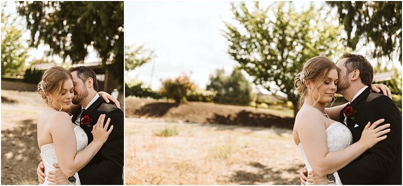 Premier Snohomish & Seattle Wedding Photographer | GSquared Weddings Photography A bride and groom embrace outdoors on a sunny day during their Snohomish wedding, standing close together with eyes closed. The bride wears a strapless white dress, the groom a black suit, with trees and shrubs in the background. 47.9129° N, 122.0982° W | Serving Snohomish, Seattle , Orlando & Beyond