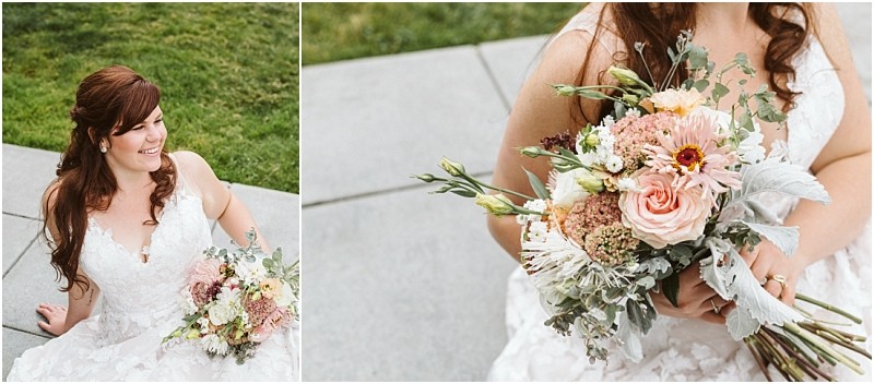 Premier Snohomish & Seattle Wedding Photographer | GSquared Weddings Photography A bride in a white lace dress holds a bouquet of pink, peach, and white flowers with greenery. She is sitting outdoors on stone steps in Snohomish near Seattle, smiling, with green grass in the background—perfect for an engagement moment. 47.9129° N, 122.0982° W | Serving Snohomish, Seattle , Orlando & Beyond