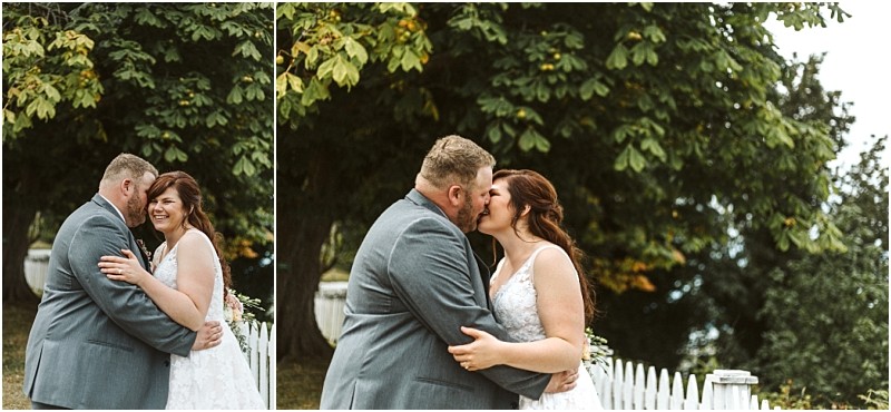 Premier Snohomish & Seattle Wedding Photographer | GSquared Weddings Photography A bride and groom stand outdoors by a white picket fence, smiling and embracing in front of green trees. In one image, they share a kiss; in the other, they laugh together on their Snohomish wedding day near Seattle. 47.9129° N, 122.0982° W | Serving Snohomish, Seattle , Orlando & Beyond