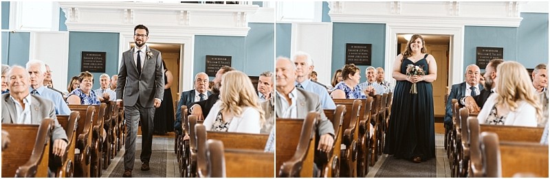 Premier Snohomish & Seattle Wedding Photographer | GSquared Weddings Photography A man in a gray suit and a woman in a dark dress walk separately down the aisle of a church during a Snohomish Seattle wedding, smiling as guests seated in pews watch and smile. 47.9129° N, 122.0982° W | Serving Snohomish, Seattle , Orlando & Beyond