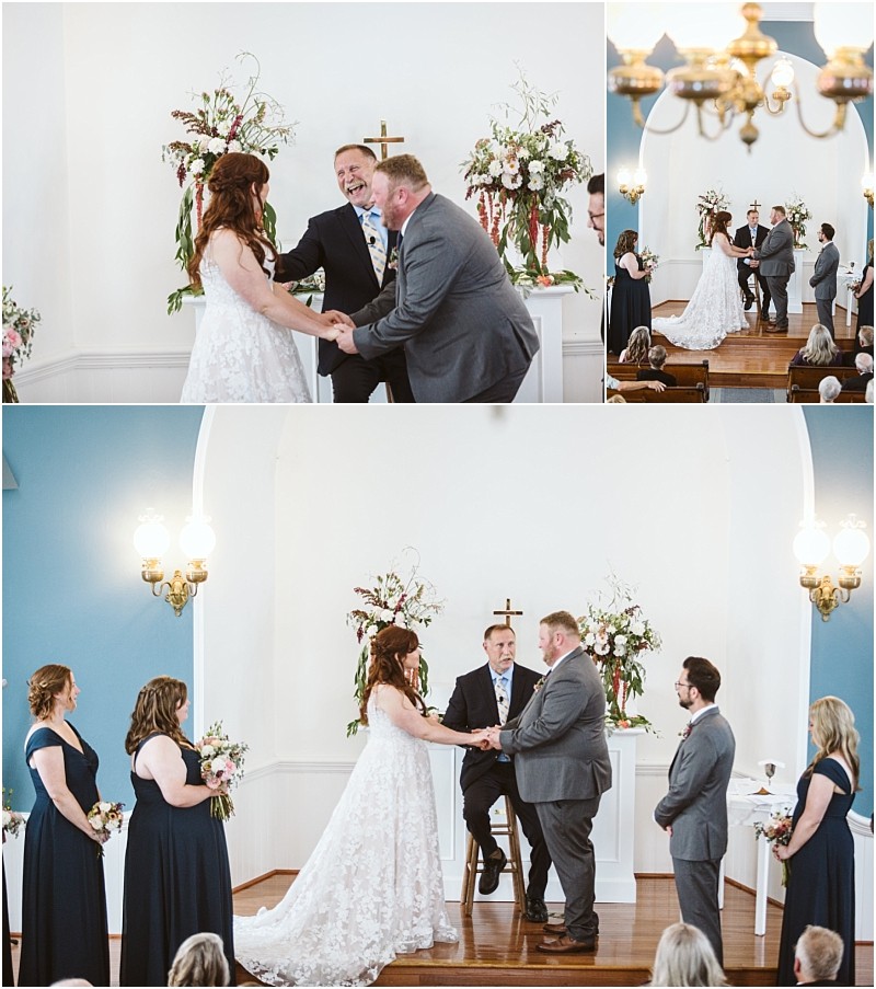 Premier Snohomish & Seattle Wedding Photographer | GSquared Weddings Photography A bride and groom hold hands and exchange vows in a small Snohomish chapel, surrounded by their wedding party and officiant. Floral arrangements and a cross decorate the altar as guests watch from the pews during this intimate Seattle wedding. 47.9129° N, 122.0982° W | Serving Snohomish, Seattle , Orlando & Beyond