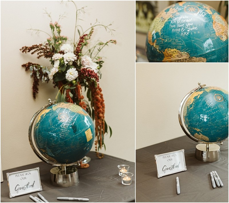 Premier Snohomish & Seattle Wedding Photographer | GSquared Weddings Photography A globe with handwritten messages sits on a table with pens and a “Please sign our guestbook” sign—perfect for your Snohomish or Seattle wedding or engagement. Behind the globe is a floral arrangement with white, pink, and red flowers. 47.9129° N, 122.0982° W | Serving Snohomish, Seattle , Orlando & Beyond