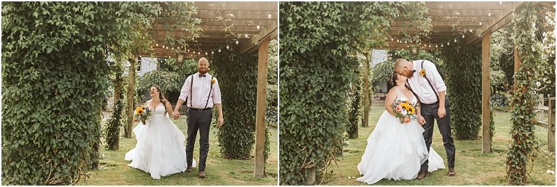 Premier Snohomish & Seattle Wedding Photographer | GSquared Weddings Photography A bride in a white dress holds a sunflower bouquet and walks under a vine-covered pergola, smiling with her groom during their Snohomish wedding. In the next frame, they share a kiss in the same romantic garden setting. 47.9129° N, 122.0982° W | Serving Snohomish, Seattle , Orlando & Beyond