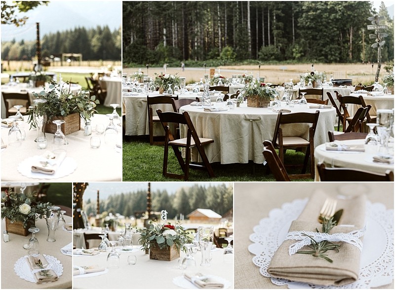 Premier Snohomish & Seattle Wedding Photographer | GSquared Weddings Photography Rustic outdoor wedding reception near Snohomish Seattle, with round tables set with beige linens, wooden chairs, mason jar centerpieces of greenery, and napkins tied with twine and rosemary sprigs against a forested backdrop—perfect for wedding or engagement celebrations. 47.9129° N, 122.0982° W | Serving Snohomish, Seattle , Orlando & Beyond