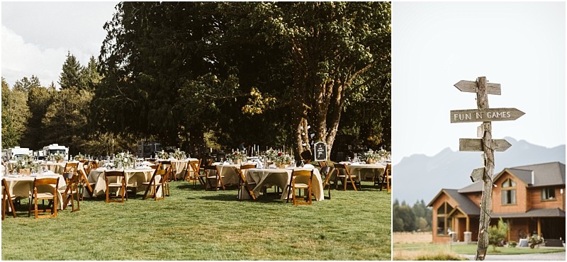 Premier Snohomish & Seattle Wedding Photographer | GSquared Weddings Photography Outdoor wedding reception setup with round tables and wooden chairs on grass under large trees; to the right, a rustic wooden signpost points to “Fun & Games”—a picturesque Snohomish Seattle wedding scene with a house and mountains in the background. 47.9129° N, 122.0982° W | Serving Snohomish, Seattle , Orlando & Beyond