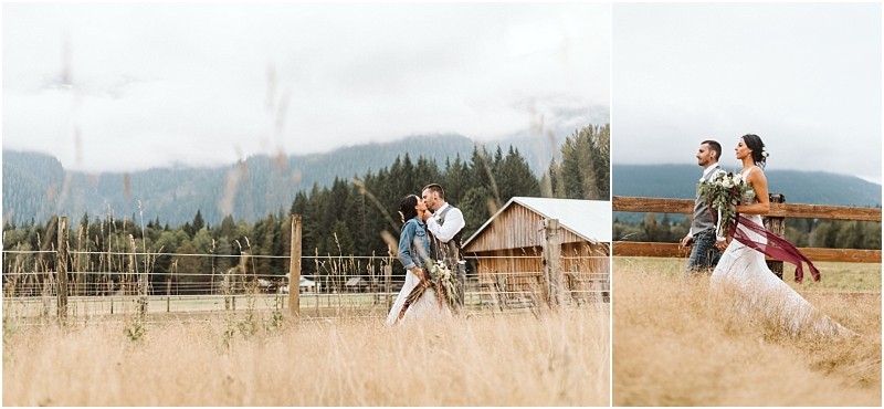 Premier Snohomish & Seattle Wedding Photographer | GSquared Weddings Photography A couple in wedding attire walks through a grassy field near a rustic barn in Snohomish, surrounded by mountains and trees on a cloudy day. The bride holds a bouquet and wears a denim jacket in one image—perfect for a Seattle wedding engagement session. 47.9129° N, 122.0982° W | Serving Snohomish, Seattle , Orlando & Beyond