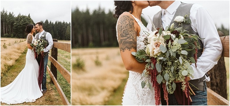 Premier Snohomish & Seattle Wedding Photographer | GSquared Weddings Photography A bride and groom stand close together by a wooden fence in a grassy field with trees behind them, dressed in rustic wedding attire. The bride holds a large bouquet—perfect for a romantic Snohomish Seattle wedding or engagement session. 47.9129° N, 122.0982° W | Serving Snohomish, Seattle , Orlando & Beyond
