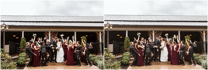 Premier Snohomish & Seattle Wedding Photographer | GSquared Weddings Photography A wedding party poses joyfully outside a rustic wooden building in Snohomish. Dressed in formal attire, the group raises their arms and bouquets in celebration on a cloudy day. The brides wear white and the bridesmaids wear dark red dresses. 47.9129° N, 122.0982° W | Serving Snohomish, Seattle , Orlando & Beyond