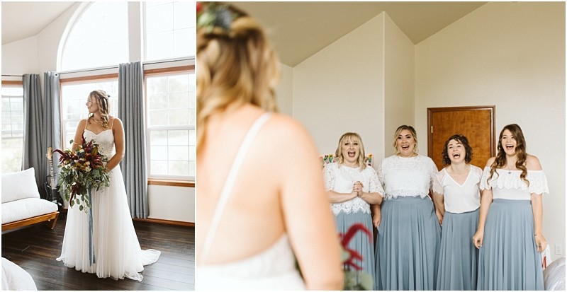 Premier Snohomish & Seattle Wedding Photographer | GSquared Weddings Photography A bride in a white dress holds a bouquet and stands by a window, while four bridesmaids in matching blue skirts and white tops smile excitedly at her inside a bright room during a beautiful Snohomish Seattle wedding. 47.9129° N, 122.0982° W | Serving Snohomish, Seattle , Orlando & Beyond