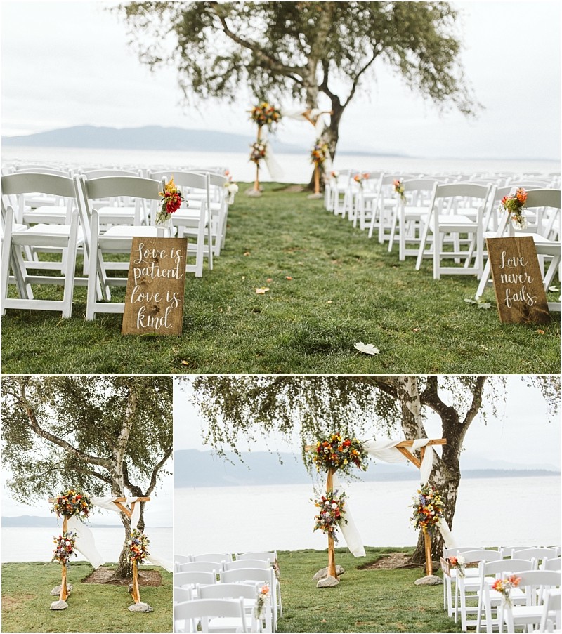Premier Snohomish & Seattle Wedding Photographer | GSquared Weddings Photography An outdoor Snohomish wedding setup by a lake features rows of white chairs, floral arrangements, and two wooden signs with “Love is patient, love is kind” and “Love never fails” in elegant white script. 47.9129° N, 122.0982° W | Serving Snohomish, Seattle , Orlando & Beyond