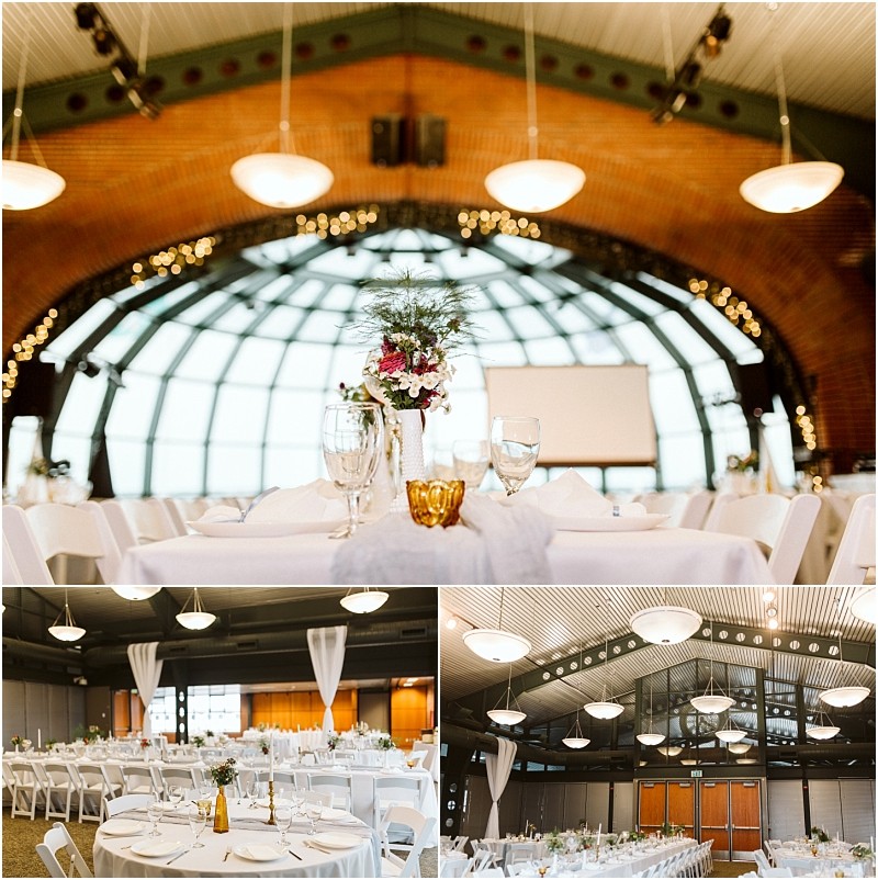 Premier Snohomish & Seattle Wedding Photographer | GSquared Weddings Photography A Snohomish wedding venue with round tables set for an event, white tablecloths, floral centerpieces, and elegant lighting under a high arched ceiling with large windows and brick walls—perfect for your Seattle engagement. 47.9129° N, 122.0982° W | Serving Snohomish, Seattle , Orlando & Beyond