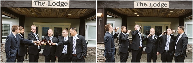 Premier Snohomish & Seattle Wedding Photographer | GSquared Weddings Photography Six men in suits stand outside a building labeled “The Lodge,” raising and drinking beer bottles together, smiling and celebrating a Snohomish Seattle wedding in a casual, outdoor setting. 47.9129° N, 122.0982° W | Serving Snohomish, Seattle , Orlando & Beyond