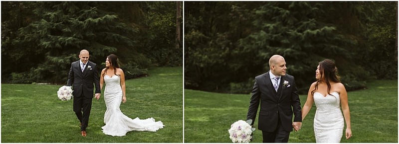 Premier Snohomish & Seattle Wedding Photographer | GSquared Weddings Photography A bride in a strapless white gown and a groom in a dark suit walk hand in hand on grass beneath trees. The groom holds a bouquet. Both smile at each other, capturing the joy of their Snohomish Seattle wedding engagement. 47.9129° N, 122.0982° W | Serving Snohomish, Seattle , Orlando & Beyond