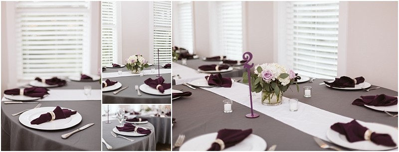 Premier Snohomish & Seattle Wedding Photographer | GSquared Weddings Photography A table set for a formal Snohomish wedding features gray tablecloths, white plates, silver cutlery, purple napkins, and a floral centerpiece with white and purple flowers. Sunlight streams through the white blinds behind. 47.9129° N, 122.0982° W | Serving Snohomish, Seattle , Orlando & Beyond