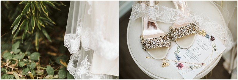 Premier Snohomish & Seattle Wedding Photographer | GSquared Weddings Photography Close-up of a lace wedding veil near greenery at a Snohomish Seattle wedding, with jeweled bridal shoes, lace, jewelry, and a floral invitation arranged on a round table. 47.9129° N, 122.0982° W | Serving Snohomish, Seattle , Orlando & Beyond