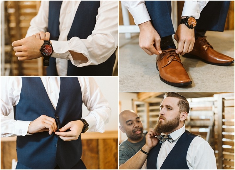 Premier Snohomish & Seattle Wedding Photographer | GSquared Weddings Photography A man in a navy suit gets ready for a Snohomish Seattle wedding, adjusting his watch, shoes, vest, and having his bow tie fixed by another man in a light shirt. 47.9129° N, 122.0982° W | Serving Snohomish, Seattle , Orlando & Beyond