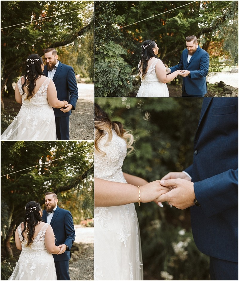 Premier Snohomish & Seattle Wedding Photographer | GSquared Weddings Photography A bride and groom share an emotional first look outdoors under trees at their Snohomish Seattle wedding. Facing each other, they hold hands and smile warmly, dressed in a white gown and navy suit. Close-ups capture loving expressions. 47.9129° N, 122.0982° W | Serving Snohomish, Seattle , Orlando & Beyond