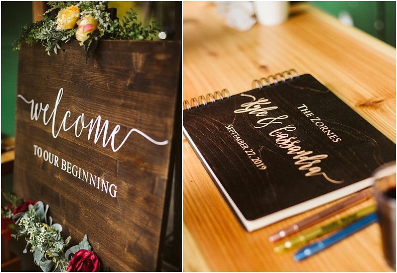 Premier Snohomish & Seattle Wedding Photographer | GSquared Weddings Photography A wooden sign with white lettering reads Welcome to our beginning, surrounded by flowers. At this Snohomish Seattle wedding, a guestbook labeled The Zones, Kyle & Cassandra, September 21, 2019 sits on a table with pens. 47.9129° N, 122.0982° W | Serving Snohomish, Seattle , Orlando & Beyond