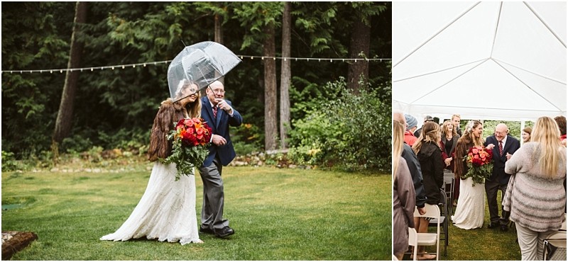 Premier Snohomish & Seattle Wedding Photographer | GSquared Weddings Photography A bride in a white dress and brown shawl walks outside under a clear umbrella with an older man. Guests wait under a white tent as the pair proceed down the grassy aisle at this charming Snohomish outdoor wedding. 47.9129° N, 122.0982° W | Serving Snohomish, Seattle , Orlando & Beyond