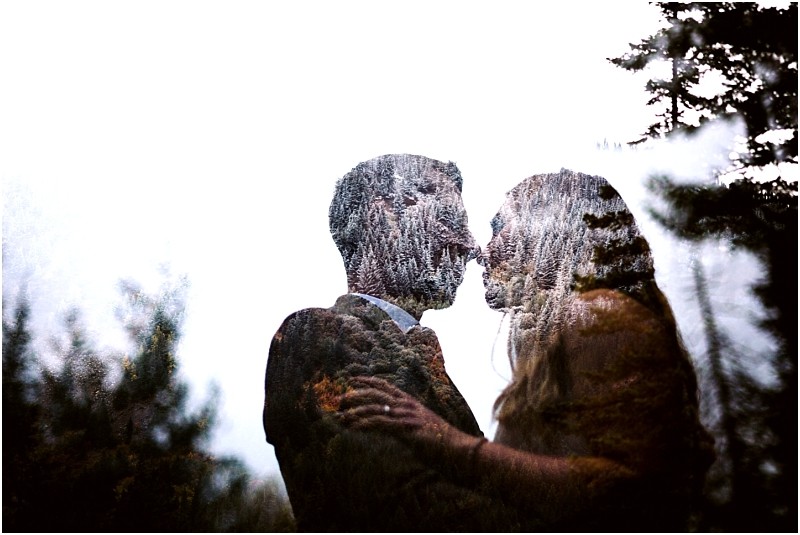 Premier Snohomish & Seattle Wedding Photographer | GSquared Weddings Photography A double exposure image of a Snohomish Seattle wedding engagement couple facing each other closely, about to kiss, with a forest scene overlay blending into their silhouettes against a bright sky. 47.9129° N, 122.0982° W | Serving Snohomish, Seattle , Orlando & Beyond
