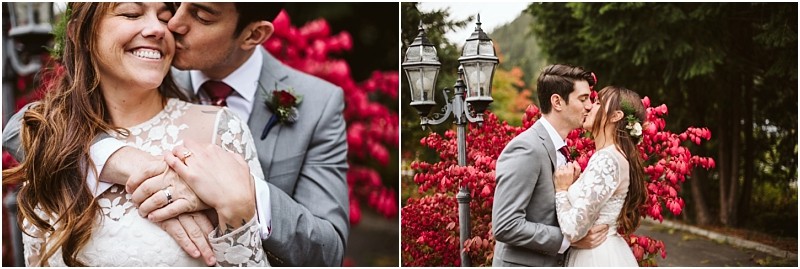 Premier Snohomish & Seattle Wedding Photographer | GSquared Weddings Photography A bride and groom embrace and kiss outdoors during their Snohomish Seattle wedding, surrounded by vibrant red foliage and tall green trees. The bride wears a white lace dress, and both look happy and in love. 47.9129° N, 122.0982° W | Serving Snohomish, Seattle , Orlando & Beyond