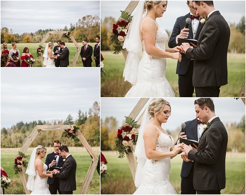 Premier Snohomish & Seattle Wedding Photographer | GSquared Weddings Photography A bride and groom exchange rings and vows outdoors during a Snohomish wedding ceremony, standing before a wooden hexagonal arch adorned with flowers, with bridesmaids and groomsmen in the background. 47.9129° N, 122.0982° W | Serving Snohomish, Seattle , Orlando & Beyond