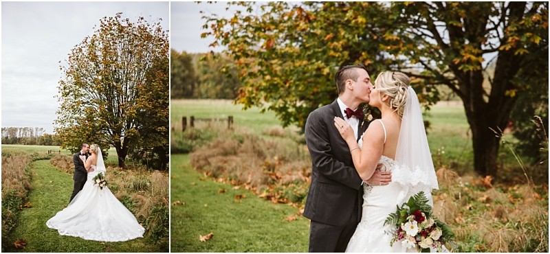 Premier Snohomish & Seattle Wedding Photographer | GSquared Weddings Photography A bride and groom share a kiss outdoors on a grassy path surrounded by autumn trees and fields during their Snohomish wedding. The bride in her white gown and veil holds a bouquet, while the groom is dressed in a dark suit. 47.9129° N, 122.0982° W | Serving Snohomish, Seattle , Orlando & Beyond