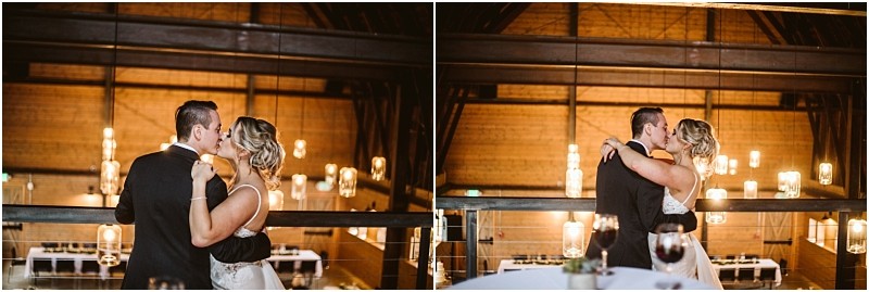 Premier Snohomish & Seattle Wedding Photographer | GSquared Weddings Photography A couple in formal attire shares a dance and a kiss on a balcony inside a warmly lit Snohomish venue with wooden walls and hanging lights, capturing the romance of a Seattle wedding engagement. 47.9129° N, 122.0982° W | Serving Snohomish, Seattle , Orlando & Beyond