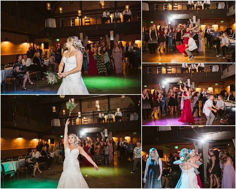 Premier Snohomish & Seattle Wedding Photographer | GSquared Weddings Photography A bride in a white dress tosses her bouquet to a group of women on the dance floor at a Snohomish wedding reception, with guests seated and watching in a warmly lit hall. 47.9129° N, 122.0982° W | Serving Snohomish, Seattle , Orlando & Beyond