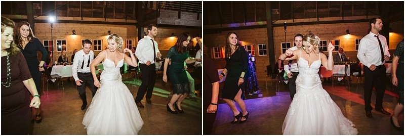 Premier Snohomish & Seattle Wedding Photographer | GSquared Weddings Photography A bride in a white gown dances joyfully with guests on a wooden floor at a rustic indoor Snohomish wedding reception. People around her are smiling and moving in sync under warm lights, capturing the charm of a Seattle engagement celebration. 47.9129° N, 122.0982° W | Serving Snohomish, Seattle , Orlando & Beyond