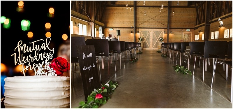 Premier Snohomish & Seattle Wedding Photographer | GSquared Weddings Photography A wedding cake with a Mutual Weirdness Forever topper and a red rose sits beside an aisle decorated with greenery and signs at a rustic Snohomish barn wedding venue near Seattle, featuring wooden walls and black chairs for an unforgettable engagement celebration. 47.9129° N, 122.0982° W | Serving Snohomish, Seattle , Orlando & Beyond
