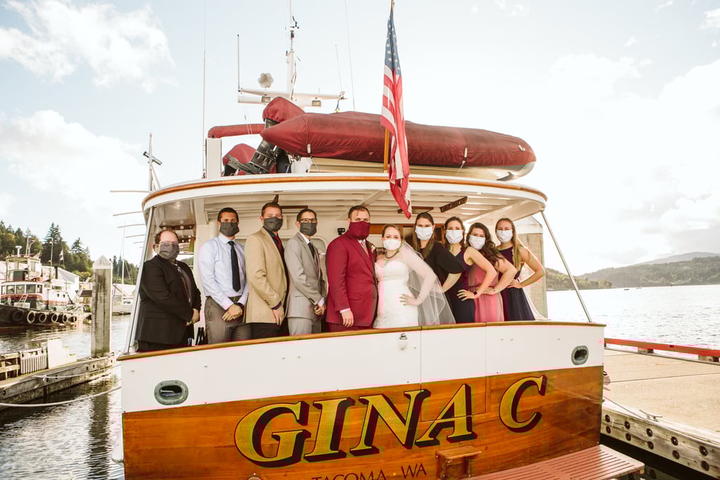 mask wearing wedding party during a covid wedding at port orchard marina in washington state