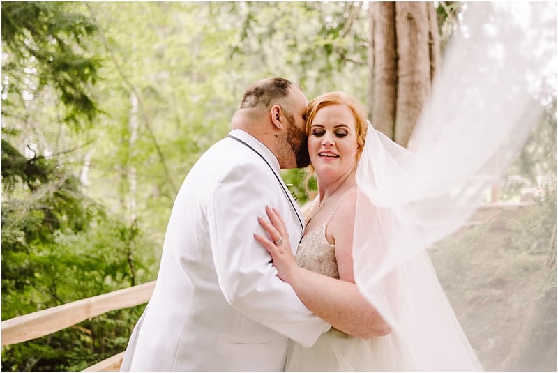 gray bridge wedding in sultan wa bride with a veil and groom in white suit