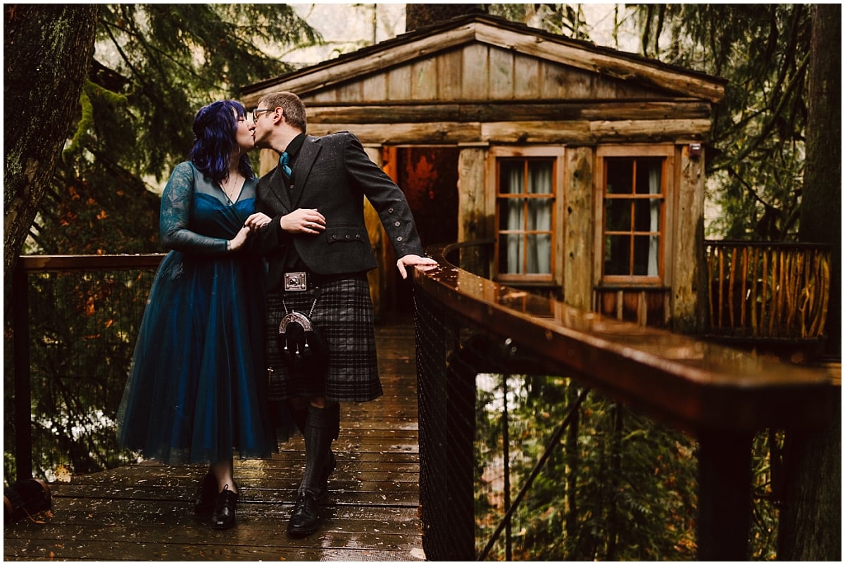 treehouse wedding at treehouse point with bride in a teal blue dress by french knot couture and groom in a scottish kilt by the blue moon treehouse in fall city wa