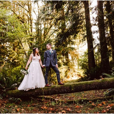 National Park inspired wedding at The Lookout Lodge in Snohomish bride and groom standing on a fallen tree