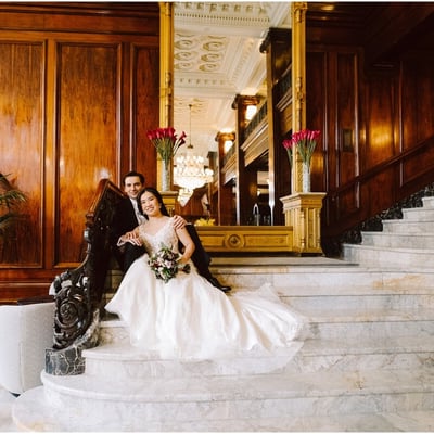 portland wedding at the benson hotel wedding couple bride and groom on the grand staircase