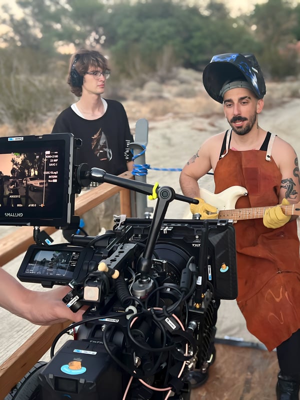 Film crew capturing musician performance on location