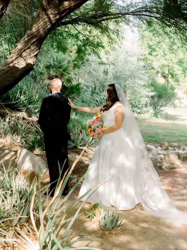 Wedding couple walking through property