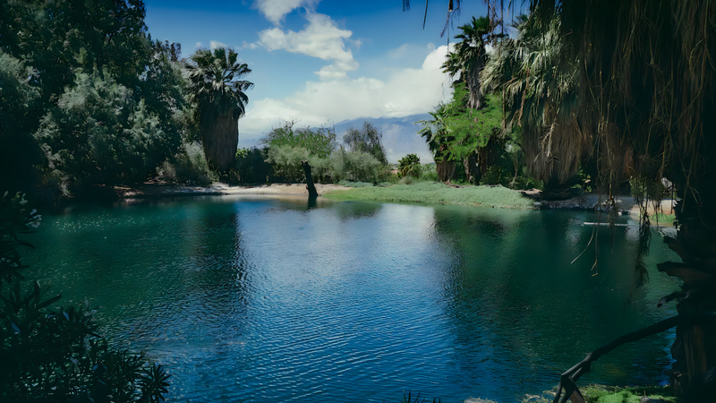 Geothermal lake water feature at Bubbling Wells Oasis desert estate