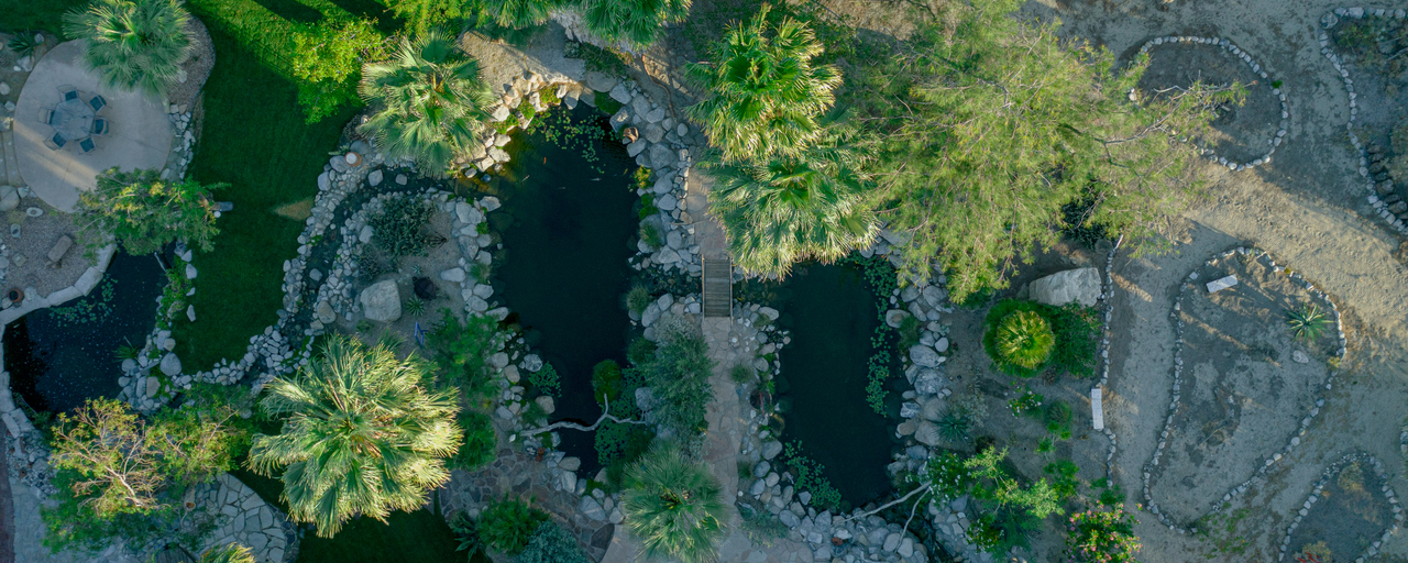 Aerial view of Bubbling Wells Oasis 107-acre private estate Desert Hot Springs