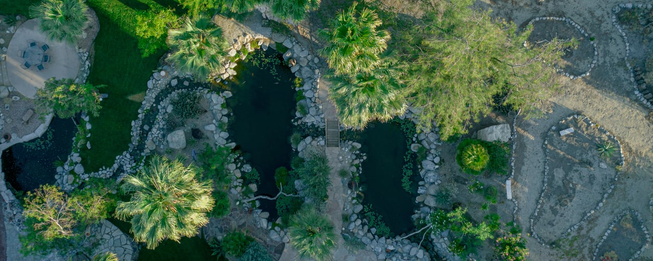 Aerial view of Bubbling Wells Oasis 107-acre private estate Desert Hot Springs