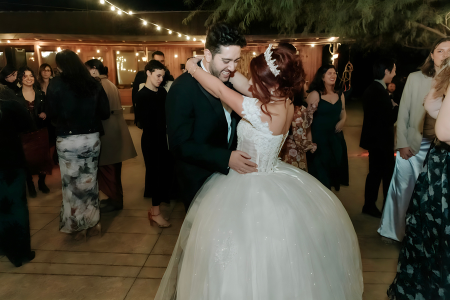 Bride and groom sharing their first dance on the outdoor dance floor