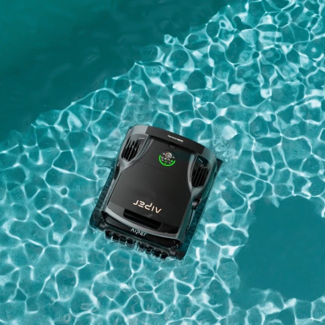 Aiper Scuba X1 Pro Max actively cleaning the water surface of a residential pool.