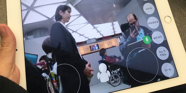 Tablet view of disabled user operating a robot