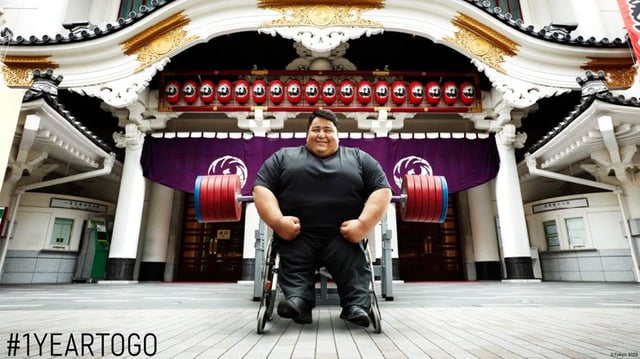 Paralympic Athlete Siamand Rahman in front of the Kabukiza Theater