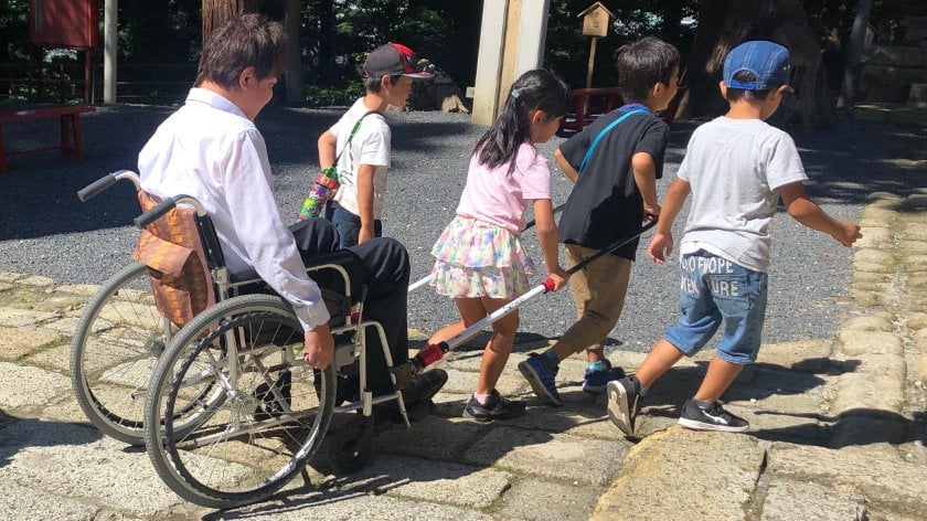 Children pullying Mr. Kato at Kumano Taisha